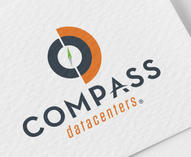 Immagine di un biglietto da visita con il logo Compass Datacenters.