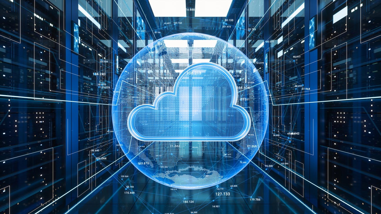 Difference between fog and cloud computing: a glowing blue cloud symbol inside a futuristic data center with transparent digital overlays and numeric data visualizations.