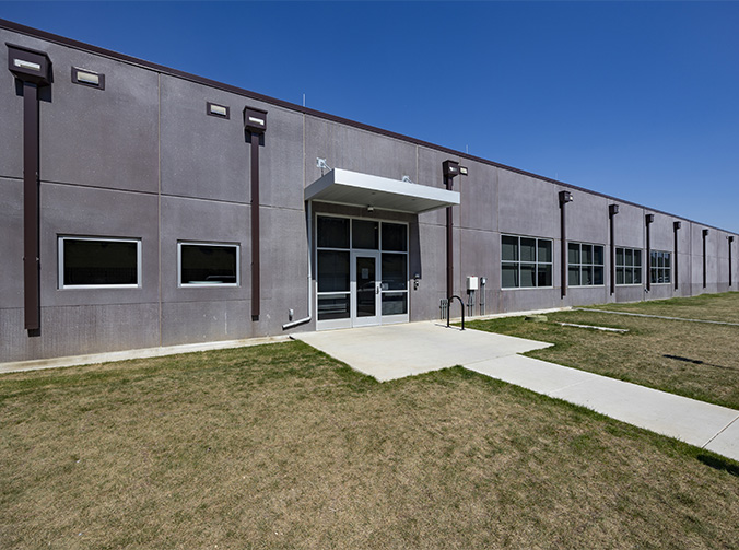 The entrance of a data center building with concrete walls