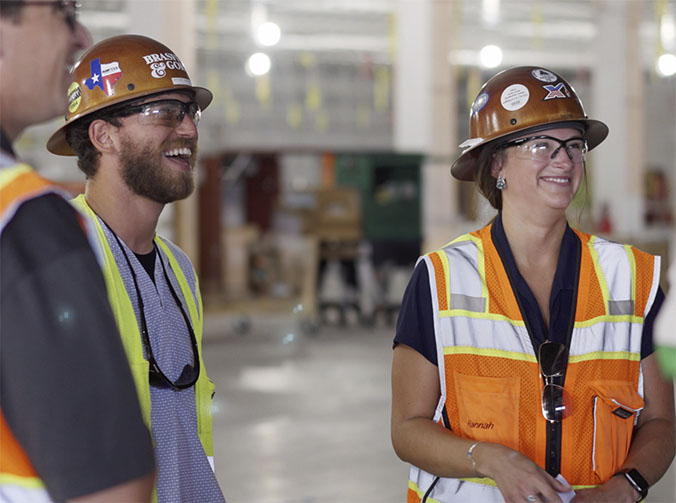 Two construction workers in safety wear at a data center campus