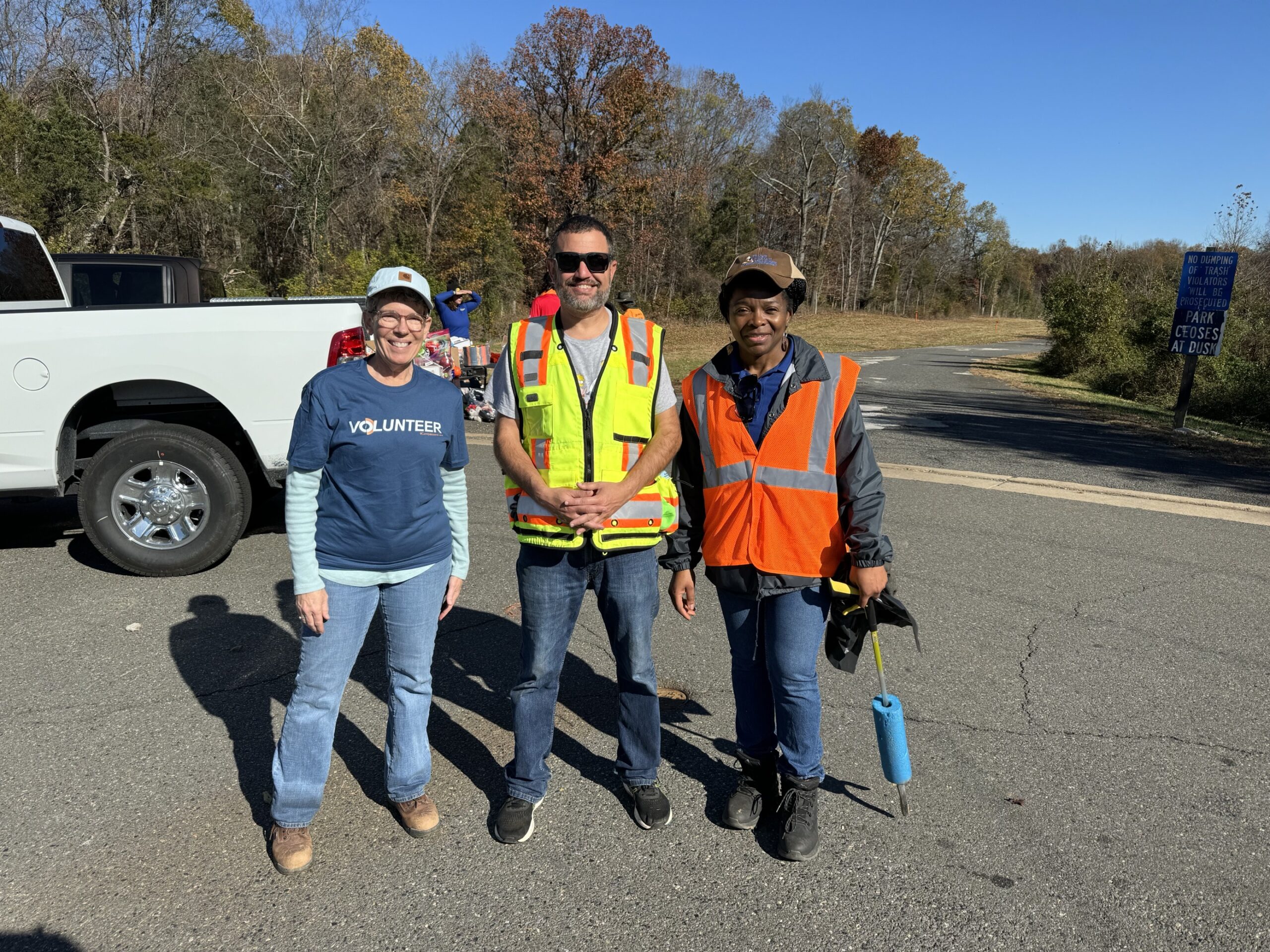 Workers posing for a photo with members of the community they are constructing the data center in.