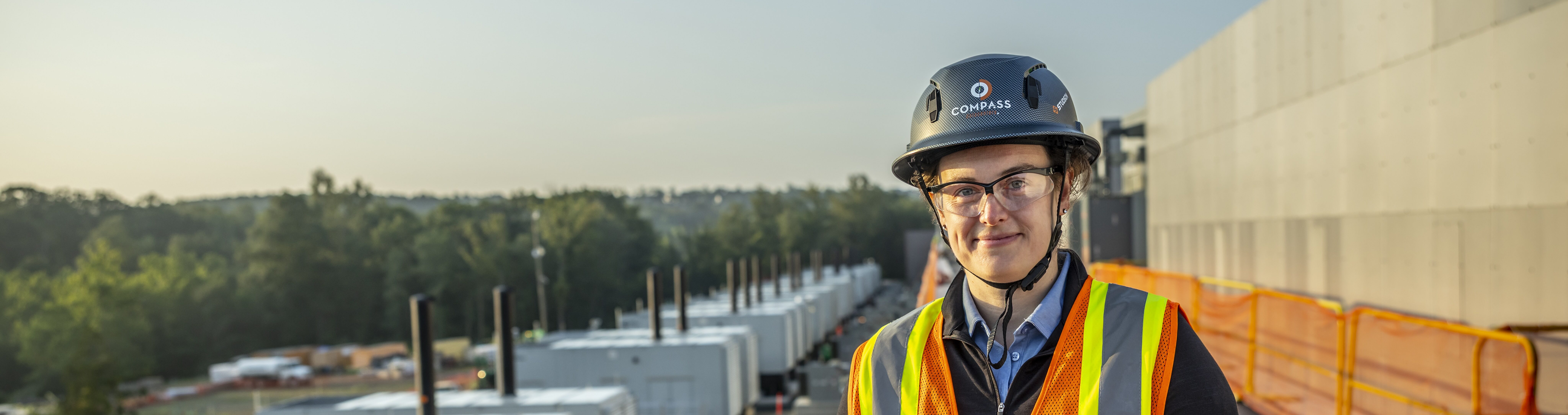 Exterior view of the Compass Datacenters Leesburg, Virginia campus with a team member onsite.